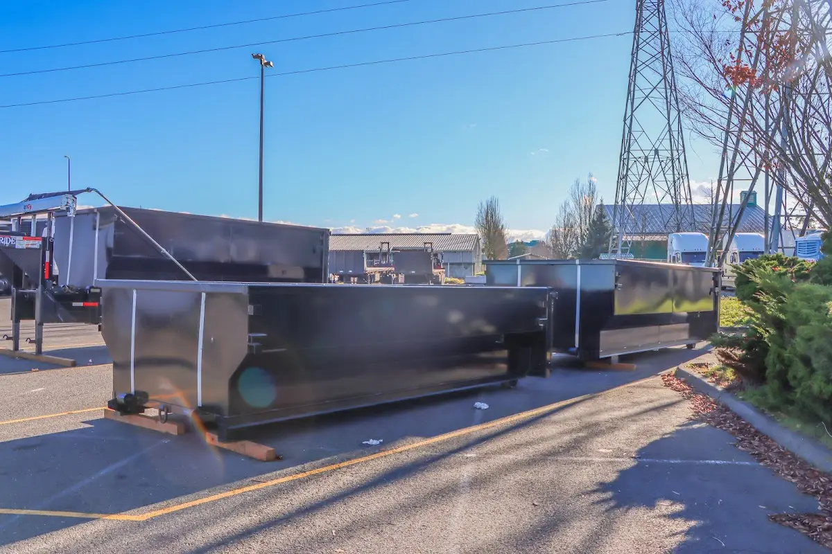 Roll-off dumpster ready for waste disposal at job site for 15 Yard Dumpster Rental in McDonough